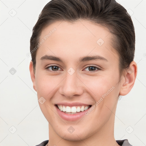 Joyful white young-adult female with short  brown hair and brown eyes