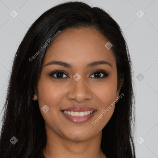 Joyful latino young-adult female with long  brown hair and brown eyes