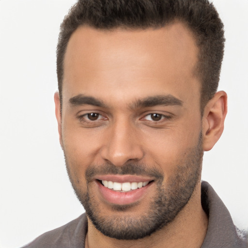 Joyful white young-adult male with short  brown hair and brown eyes