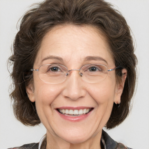 Joyful white middle-aged female with medium  brown hair and brown eyes