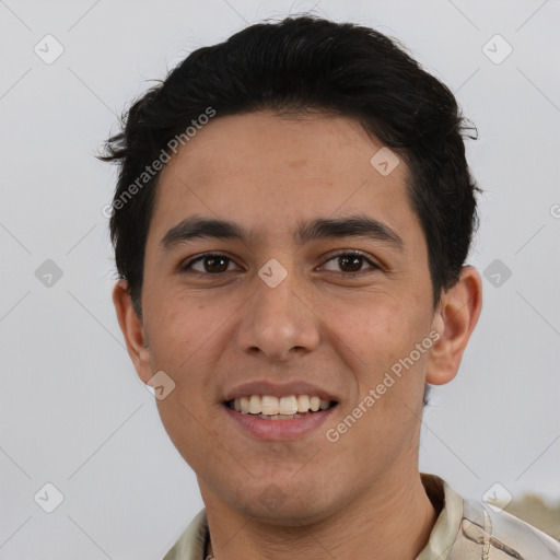 Joyful white young-adult male with short  black hair and brown eyes