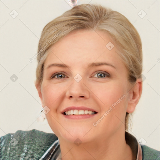 Joyful white young-adult female with medium  brown hair and blue eyes