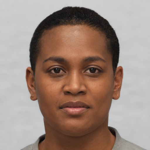 Joyful black young-adult female with short  brown hair and brown eyes