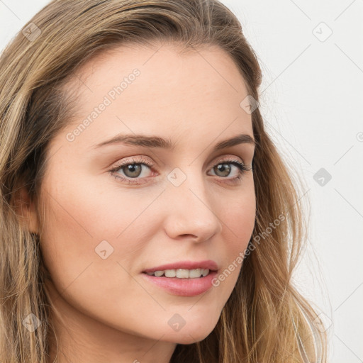 Joyful white young-adult female with long  brown hair and blue eyes