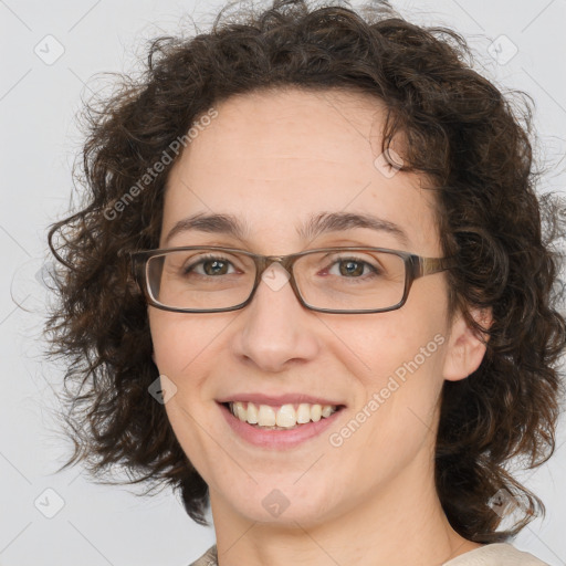 Joyful white adult female with medium  brown hair and green eyes