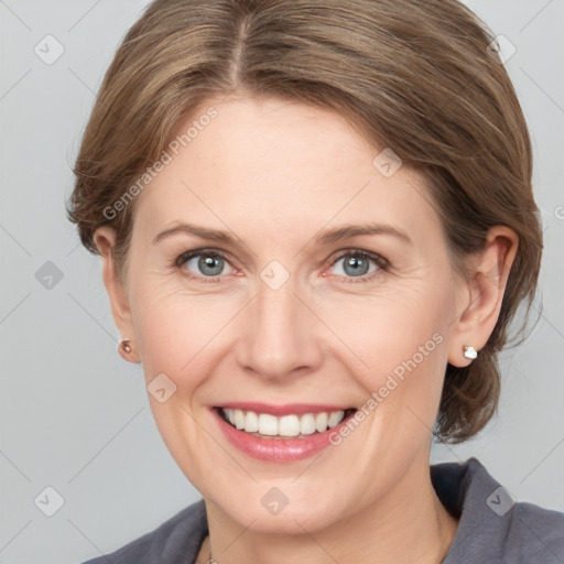 Joyful white adult female with medium  brown hair and grey eyes