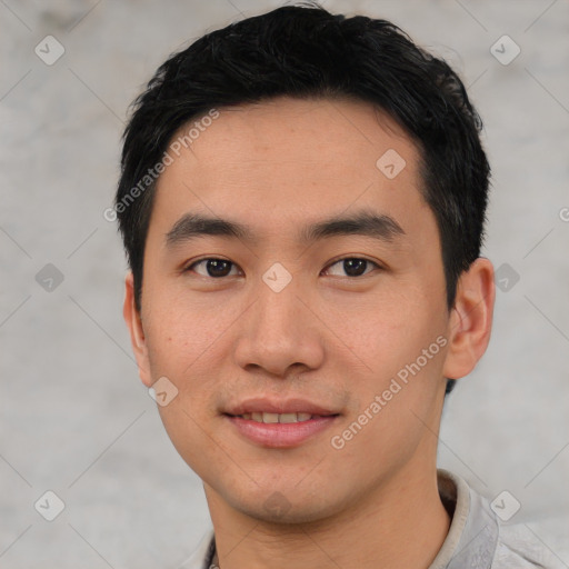 Joyful asian young-adult male with short  black hair and brown eyes