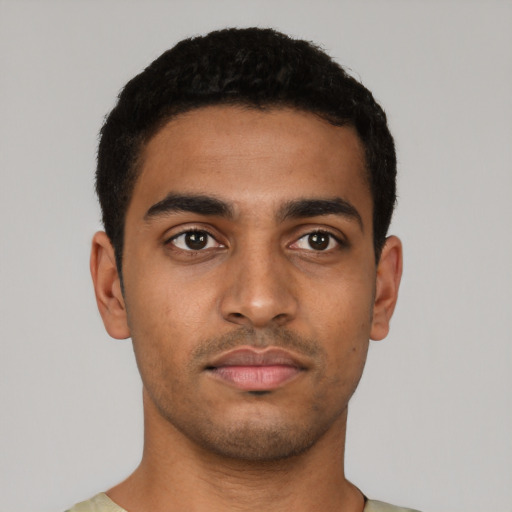 Neutral latino young-adult male with short  black hair and brown eyes