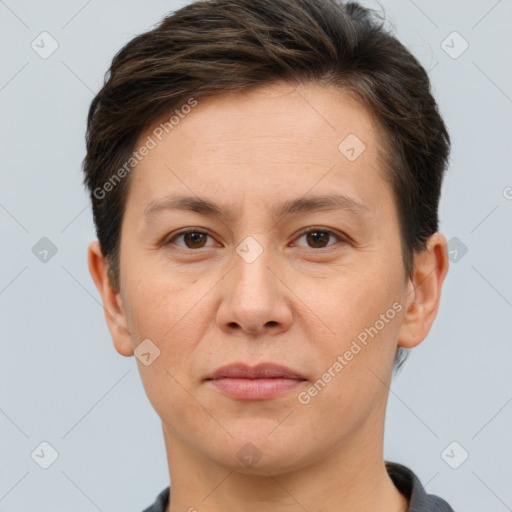 Joyful white adult female with short  brown hair and brown eyes