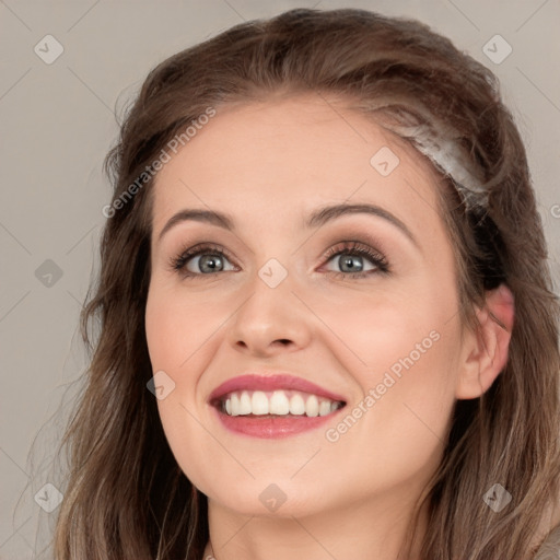 Joyful white young-adult female with long  brown hair and blue eyes