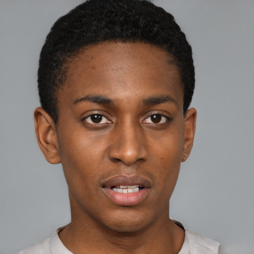 Neutral black young-adult male with short  black hair and brown eyes