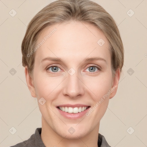 Joyful white young-adult female with short  brown hair and grey eyes