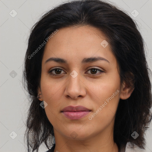 Joyful latino young-adult female with medium  brown hair and brown eyes