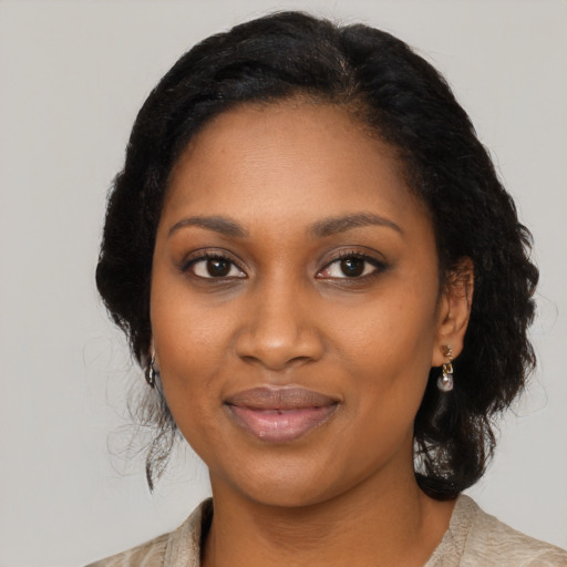 Joyful black young-adult female with medium  black hair and brown eyes
