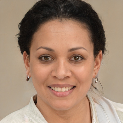 Joyful latino young-adult female with short  brown hair and brown eyes
