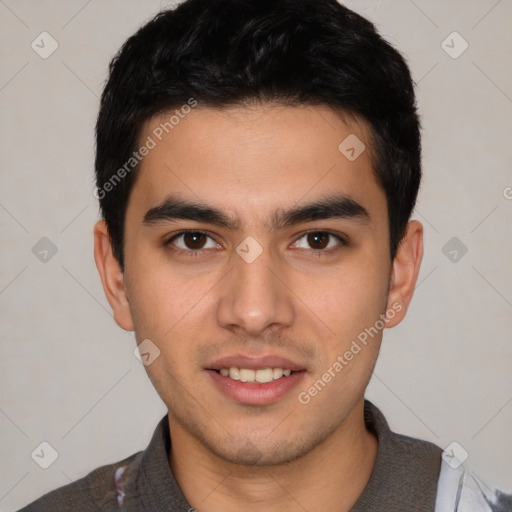 Joyful white young-adult male with short  black hair and brown eyes