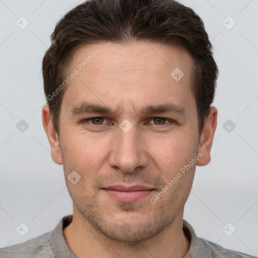 Joyful white adult male with short  brown hair and grey eyes