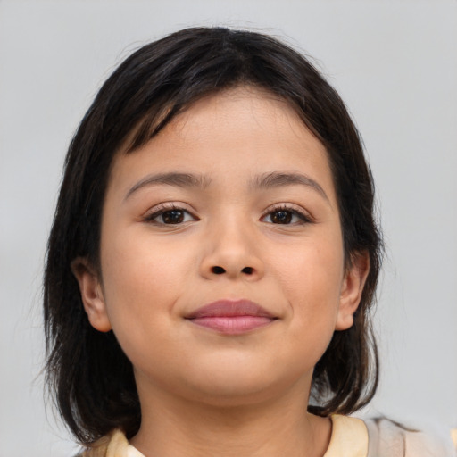 Joyful latino child female with medium  brown hair and brown eyes