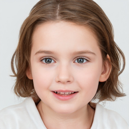 Joyful white child female with medium  brown hair and blue eyes