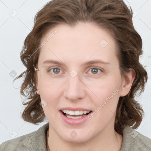 Joyful white young-adult female with medium  brown hair and blue eyes