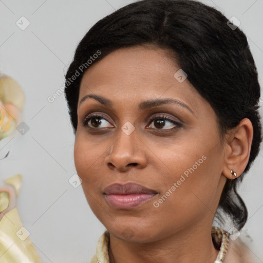 Joyful black young-adult female with medium  brown hair and brown eyes