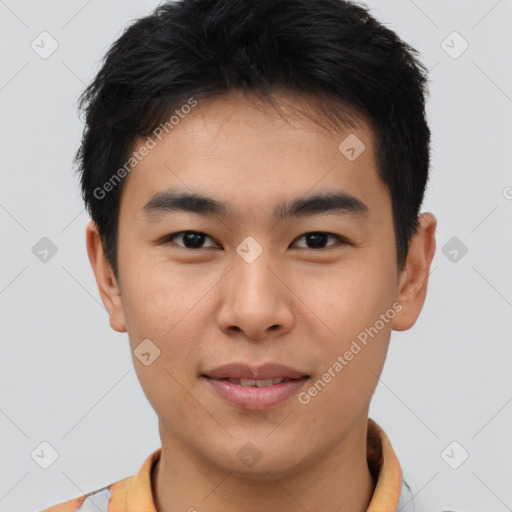 Joyful asian young-adult male with short  brown hair and brown eyes