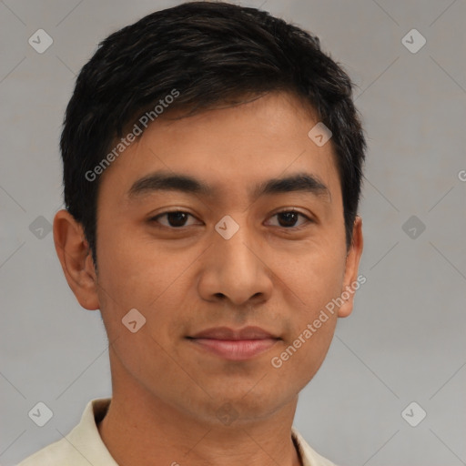 Joyful latino young-adult male with short  brown hair and brown eyes