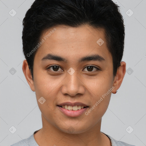 Joyful asian young-adult male with short  brown hair and brown eyes