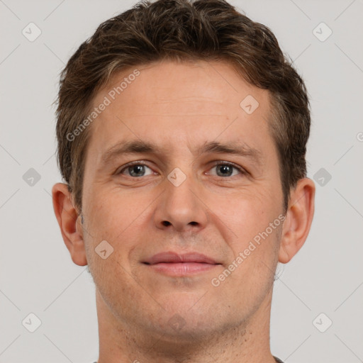 Joyful white adult male with short  brown hair and grey eyes