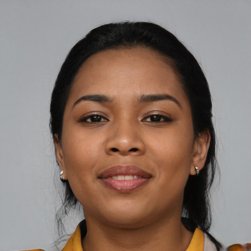 Joyful latino young-adult female with medium  black hair and brown eyes