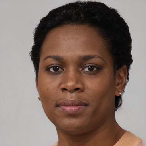 Neutral black young-adult female with short  black hair and brown eyes