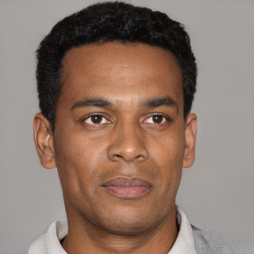Neutral black young-adult male with short  black hair and brown eyes