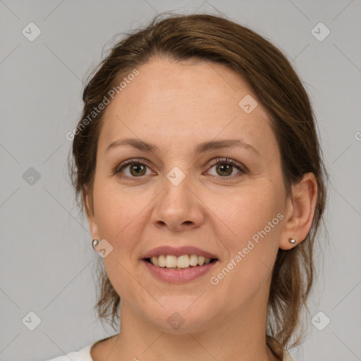 Joyful white adult female with medium  brown hair and grey eyes