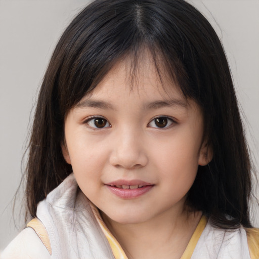 Joyful asian child female with medium  brown hair and brown eyes