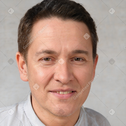 Joyful white adult male with short  brown hair and brown eyes