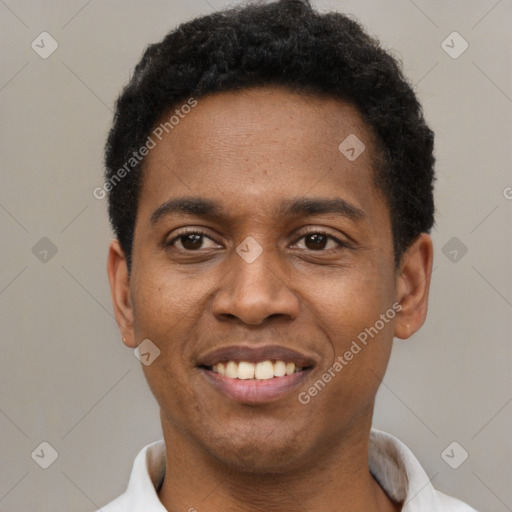 Joyful black young-adult male with short  black hair and brown eyes