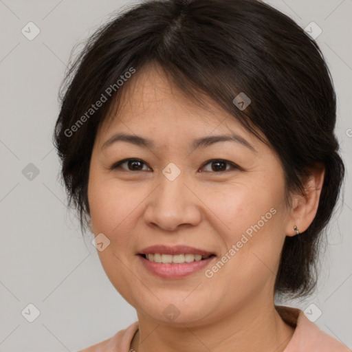 Joyful white adult female with medium  brown hair and brown eyes