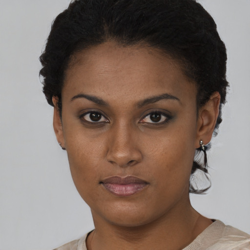 Neutral black young-adult female with short  black hair and brown eyes