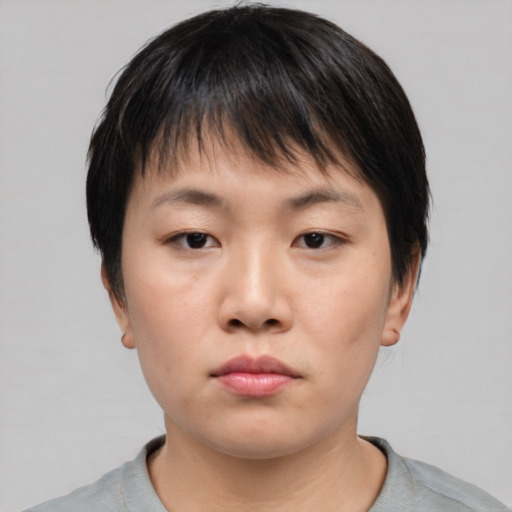Neutral asian young-adult female with short  brown hair and brown eyes