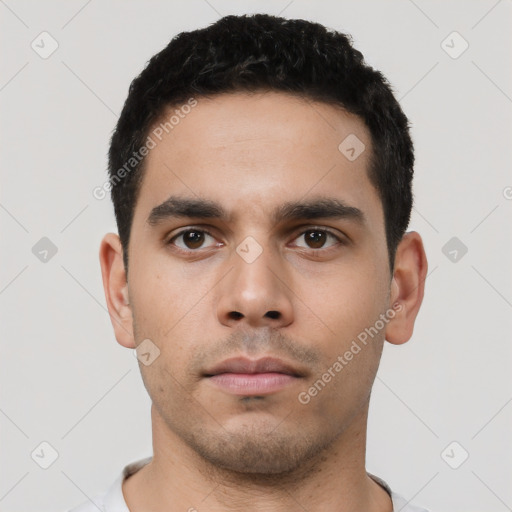 Neutral latino young-adult male with short  black hair and brown eyes