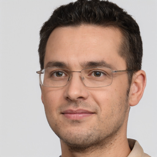 Joyful white adult male with short  brown hair and brown eyes