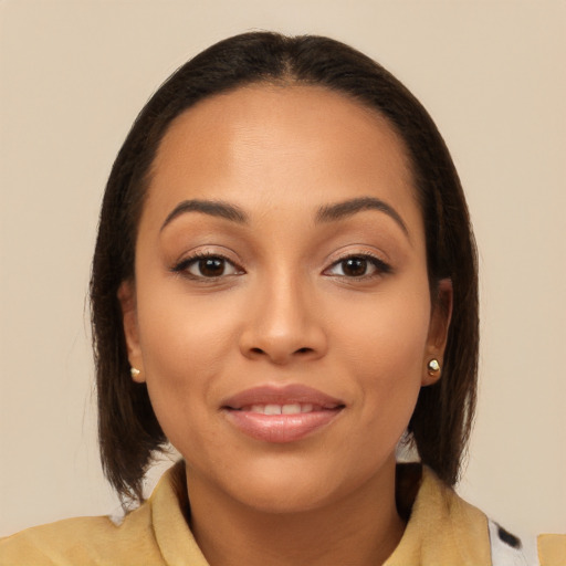 Joyful latino young-adult female with medium  brown hair and brown eyes