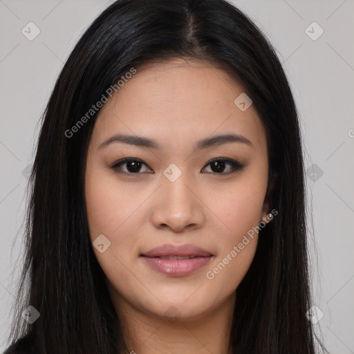 Joyful asian young-adult female with long  brown hair and brown eyes