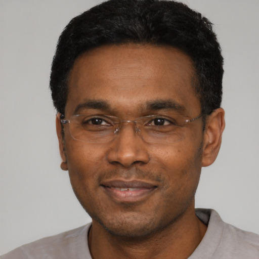 Neutral black adult male with short  black hair and brown eyes