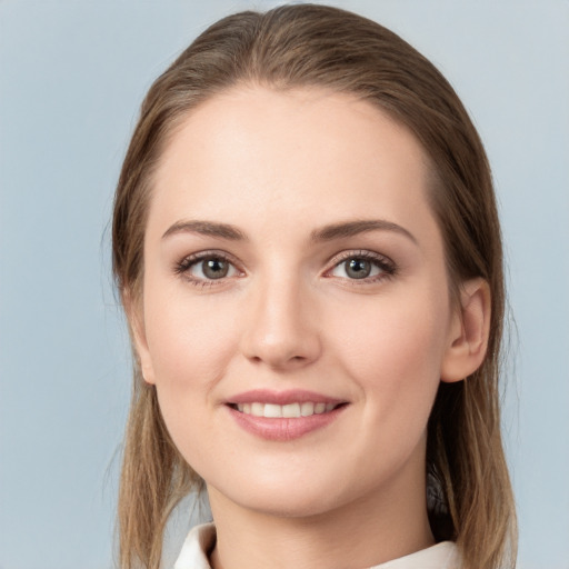 Joyful white young-adult female with medium  brown hair and grey eyes