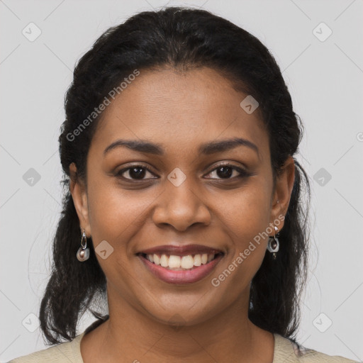 Joyful black young-adult female with long  brown hair and brown eyes