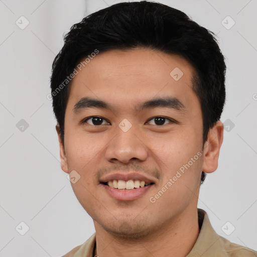 Joyful asian young-adult male with short  black hair and brown eyes