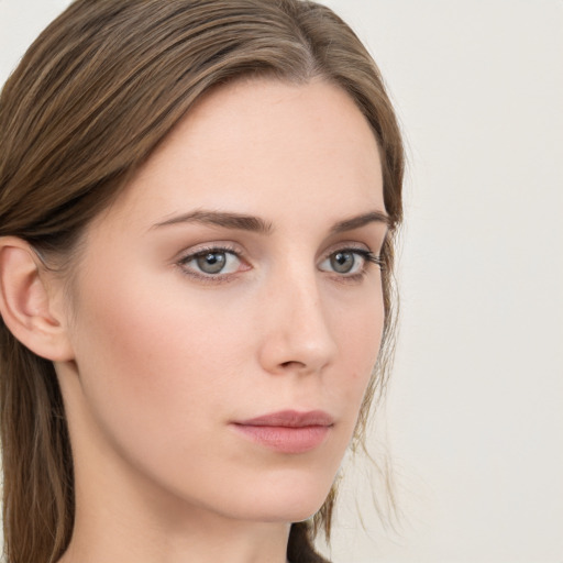 Neutral white young-adult female with long  brown hair and grey eyes