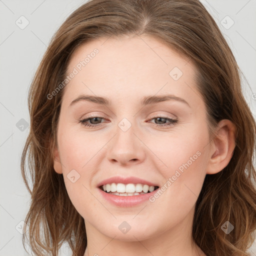 Joyful white young-adult female with long  brown hair and grey eyes