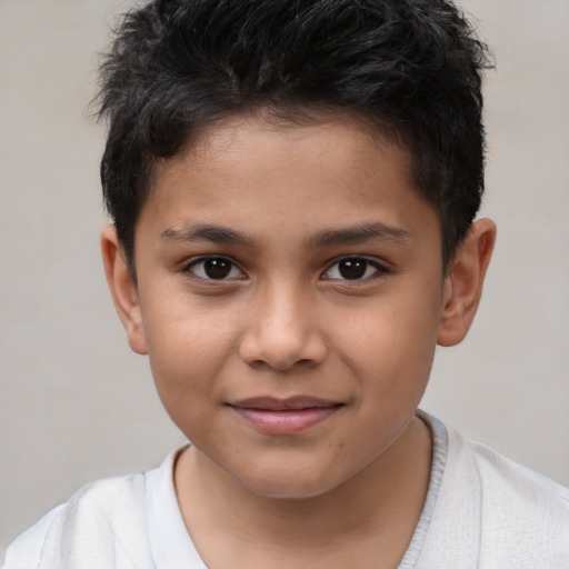 Joyful white child male with short  brown hair and brown eyes